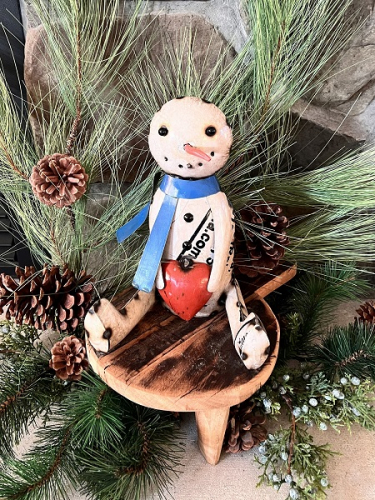 SITTING SNOWMAN HOLDING HEART AVAIL JULY 2025